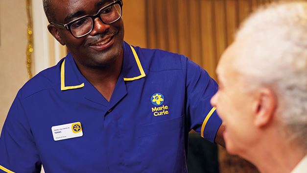 Nurse Isaac speaking to a patient